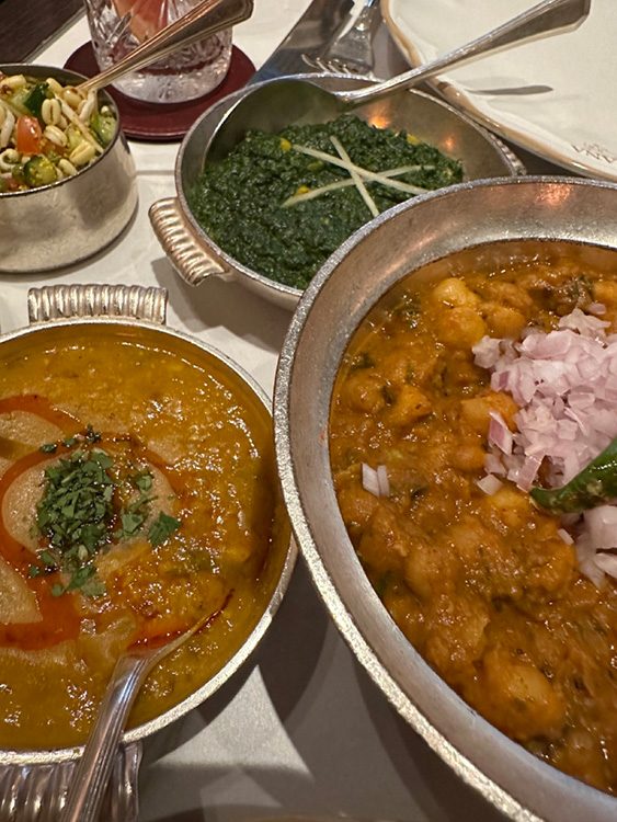 A selection of main dishes and sides at Gymkhana in Mayfair, London.