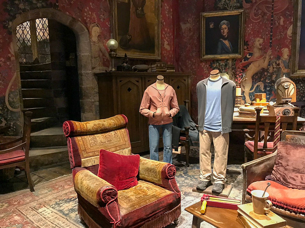 Costumes in a room set at the Harry Potter Studio Tour, London, England.