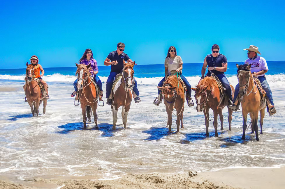 Horseback riding on the beach at Cabo San Lucas, Mexico.