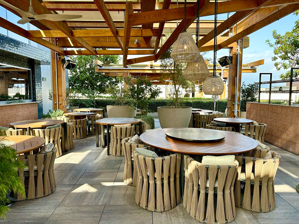 Outdoor seating in Alto at the Conrad Los Angeles hotel, California.