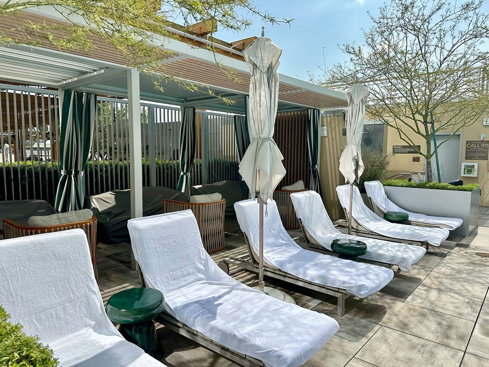 Lounge seats by the pool at the Conrad Los Angeles hotel, California.