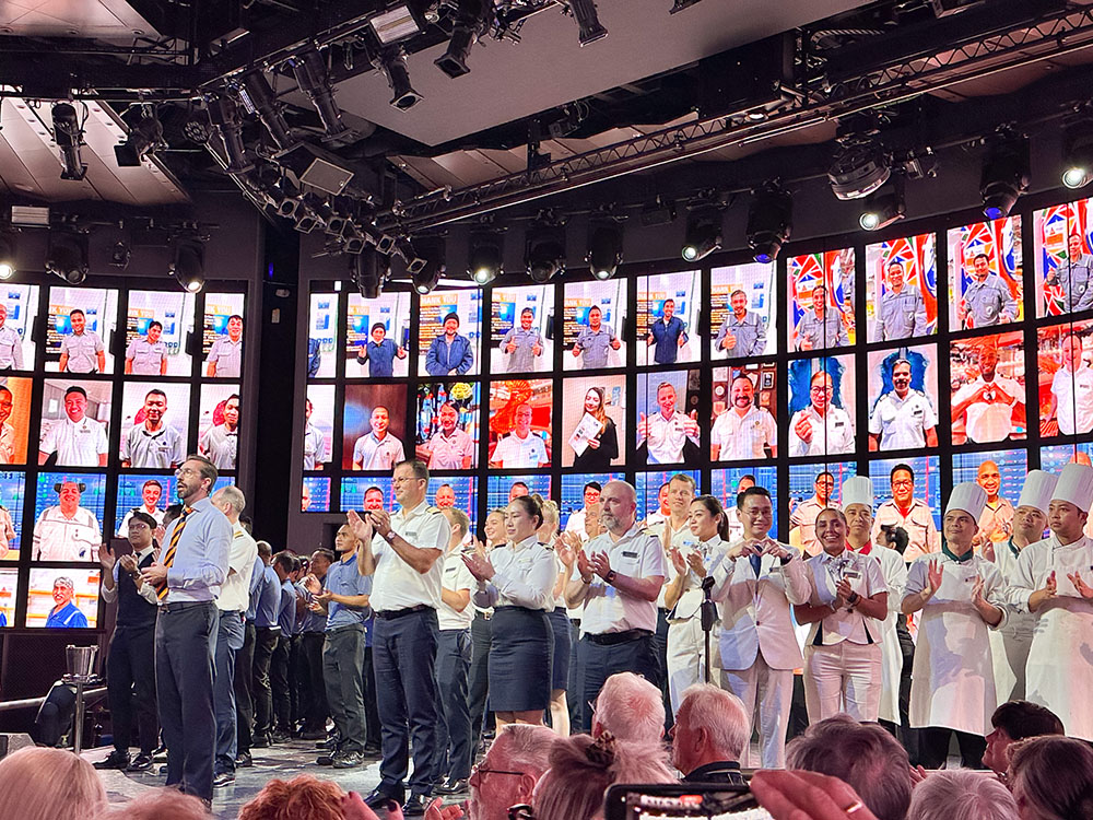 Crew members taking part in the City at Sea presentation on board the Holland America Line MS Rotterdam.