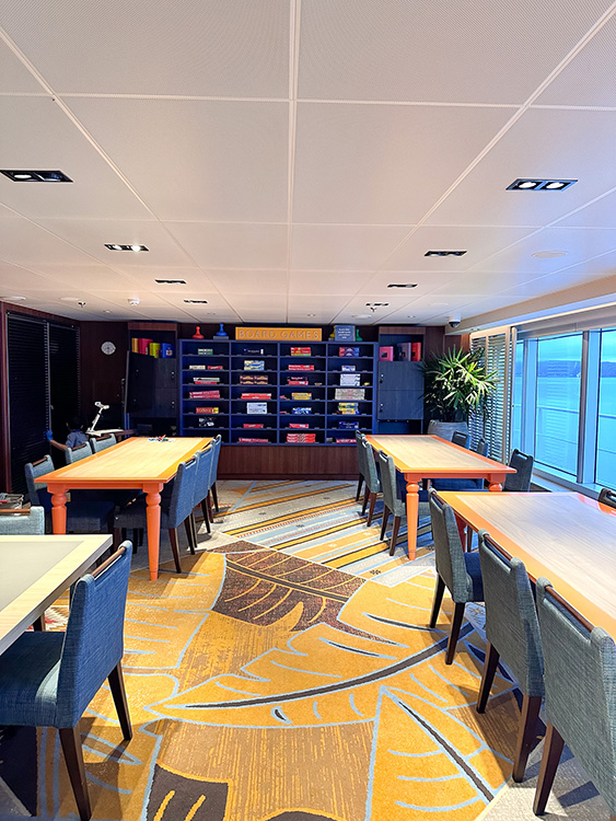 The game room with board games and jigsaw puzzles on board the Holland America Line MS Rotterdam.