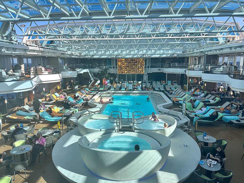 The Lido Deck pool under a glass roof on board the Holland America Line MS Rotterdam.