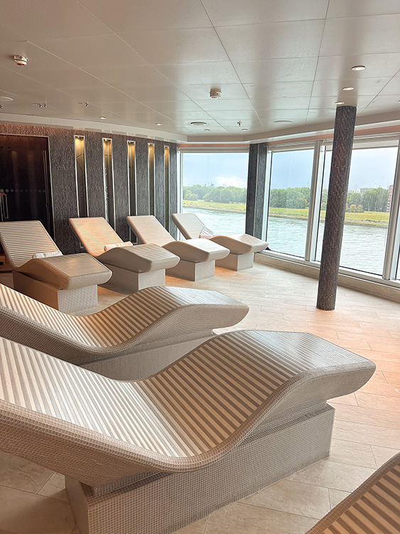 Heated lounge chairs in the Greenhouse Spa & Salon on the Holland America Line MS Rotterdam.