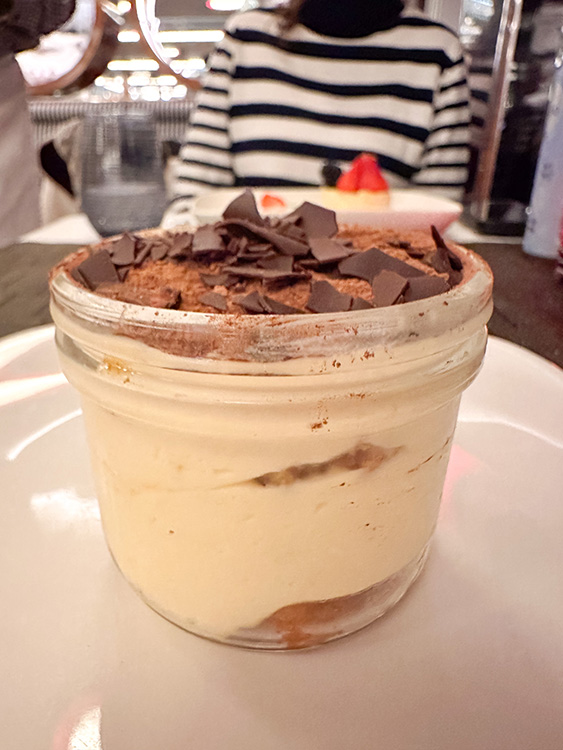 An individual tiramisu served in a glass jar at Canaletto on board the MS Rotterdam.