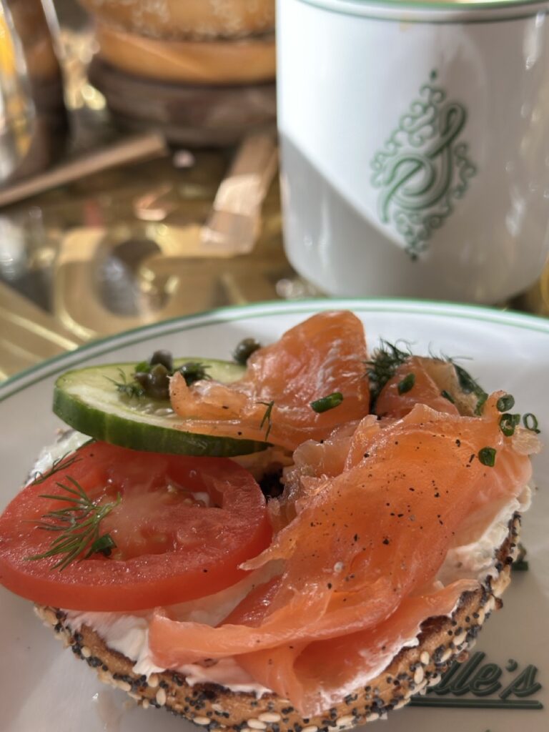 A toasted bagel topped with cream cheese, smoked salmon, sliced cucumber and tomato. Part of brunch at the Garden Table at the Bellagio, Las Vegas.