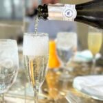 A glass of prosecco being poured for brunch at the Garden Table at the Bellagio, Las Vegas.