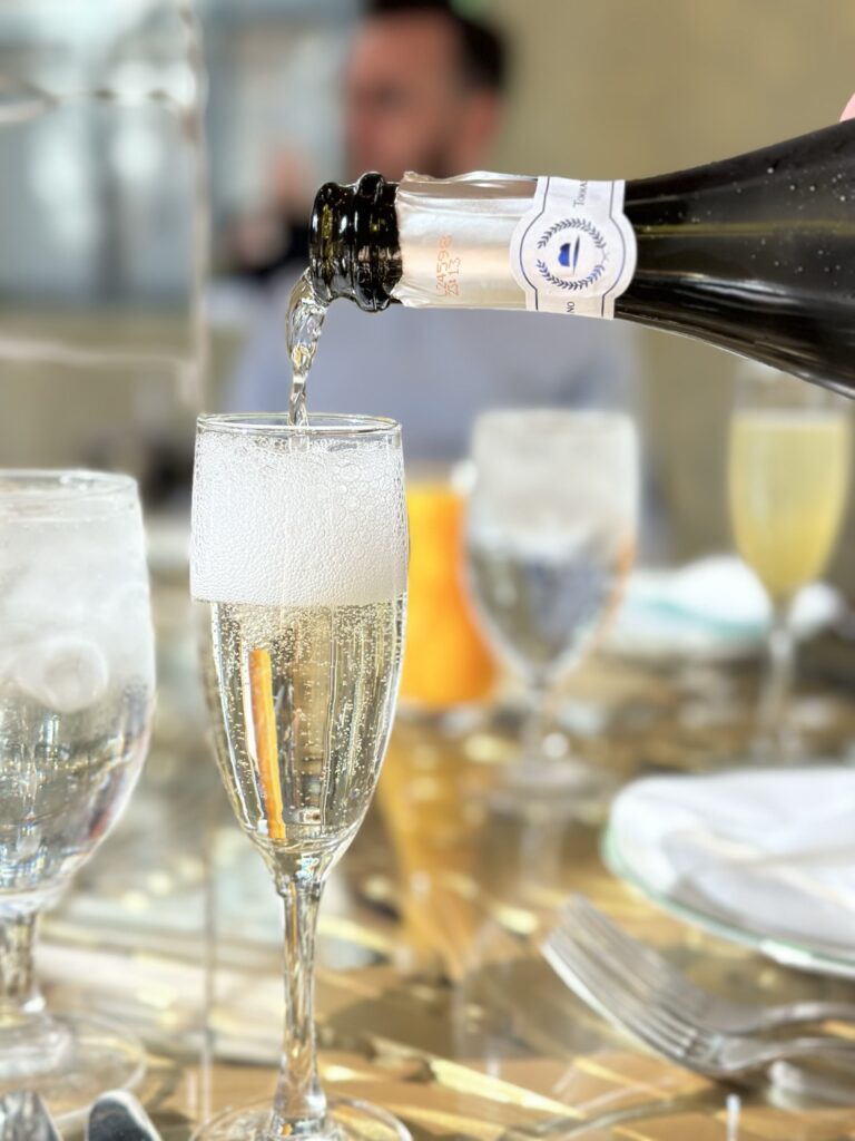 A glass of prosecco being poured for brunch at the Garden Table at the Bellagio, Las Vegas.