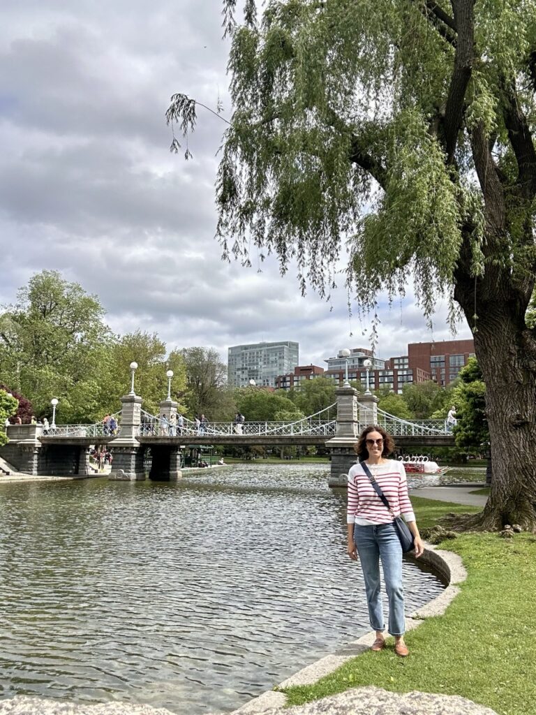 Ashley Wali stands at the water's edge on Boston Common.