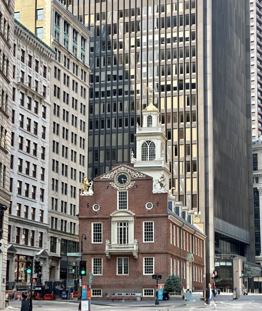 The Old State House surrounded by modern buildings in Boston, Massachusetts.