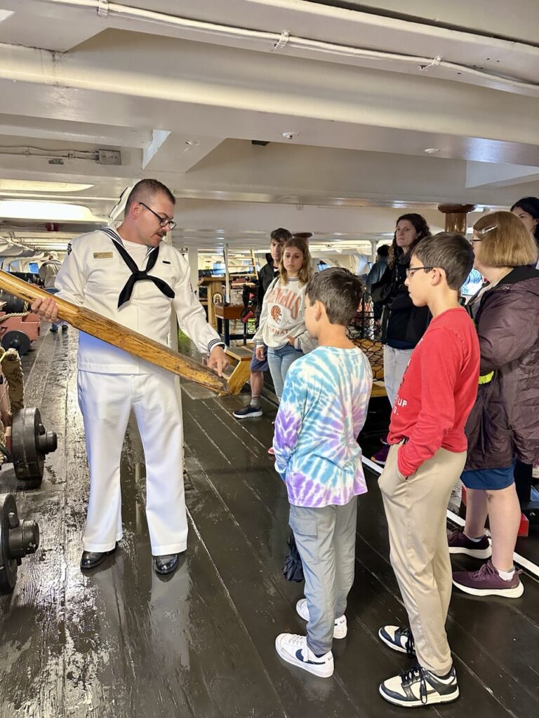 Visitors listening to a member of staff on board the USS Constitution in Boston, Massachusetts.