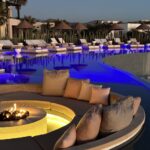 Outdoor firepit and seating area overlooking the sea at the Kimpton Mas Olas Resort And Spa near Pescadero, Mexico.