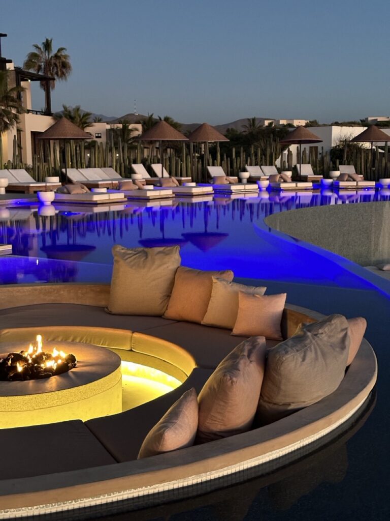 Outdoor firepit and seating area overlooking the sea at the Kimpton Mas Olas Resort And Spa near Pescadero, Mexico.