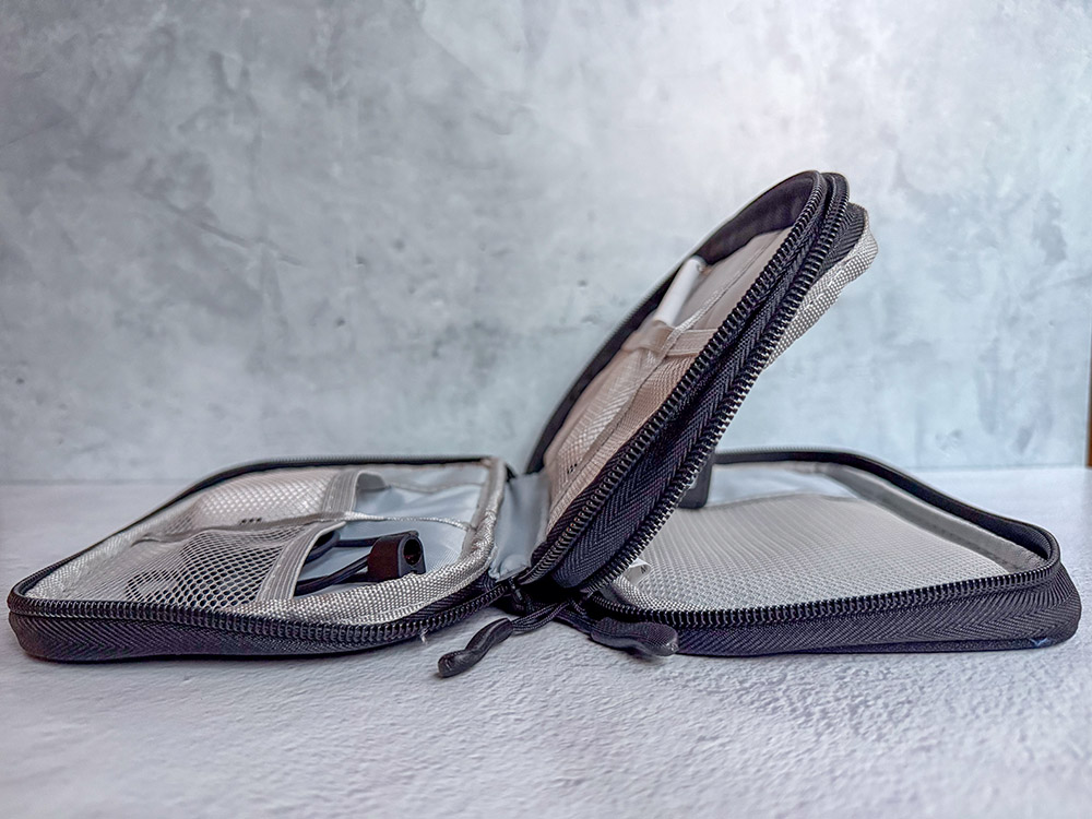 FYY Travel cable organizer showing the different compartments.