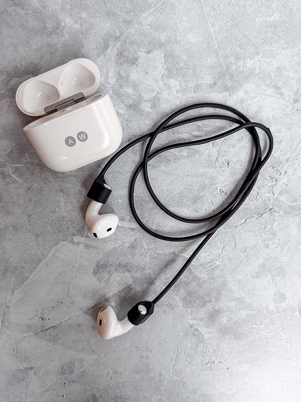 A set of Apple Airpods in the CobCobb Ultra Strong Magnetic AirPod Pro Strap.